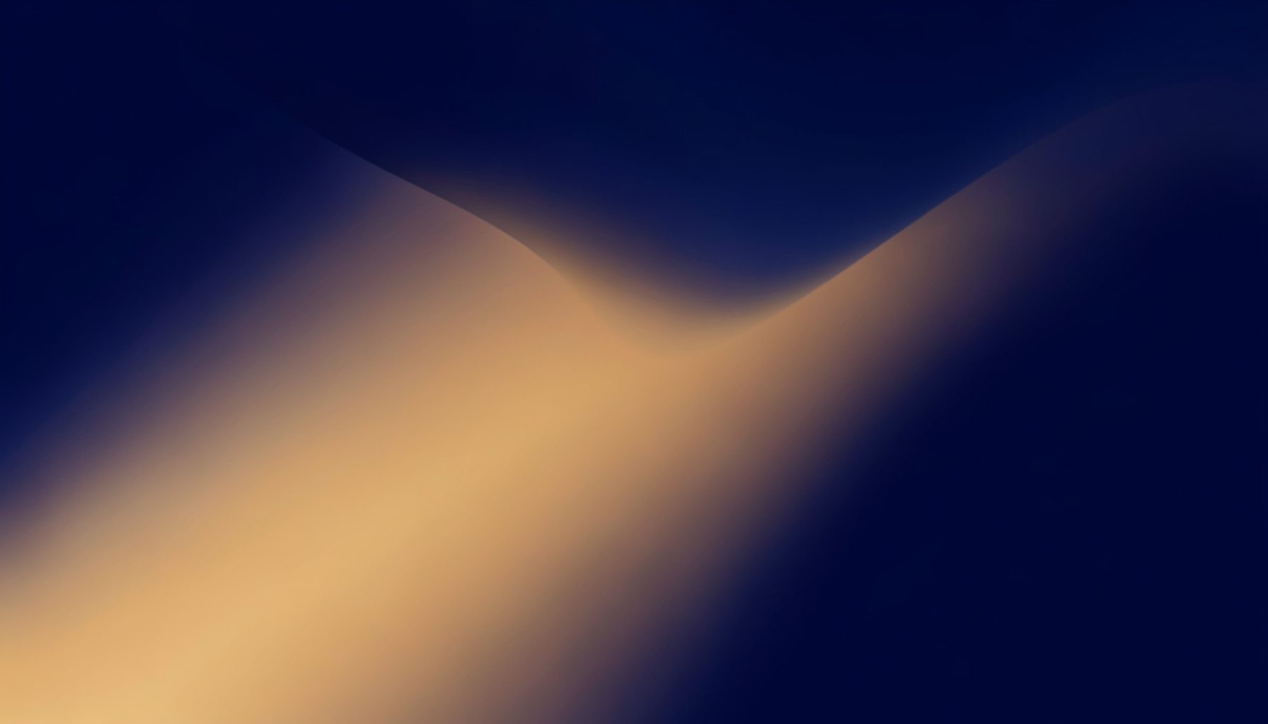 Warm abstract gradient blending deep navy and soft amber tones, with a smooth diagonal transition suggesting connection and forward motion
